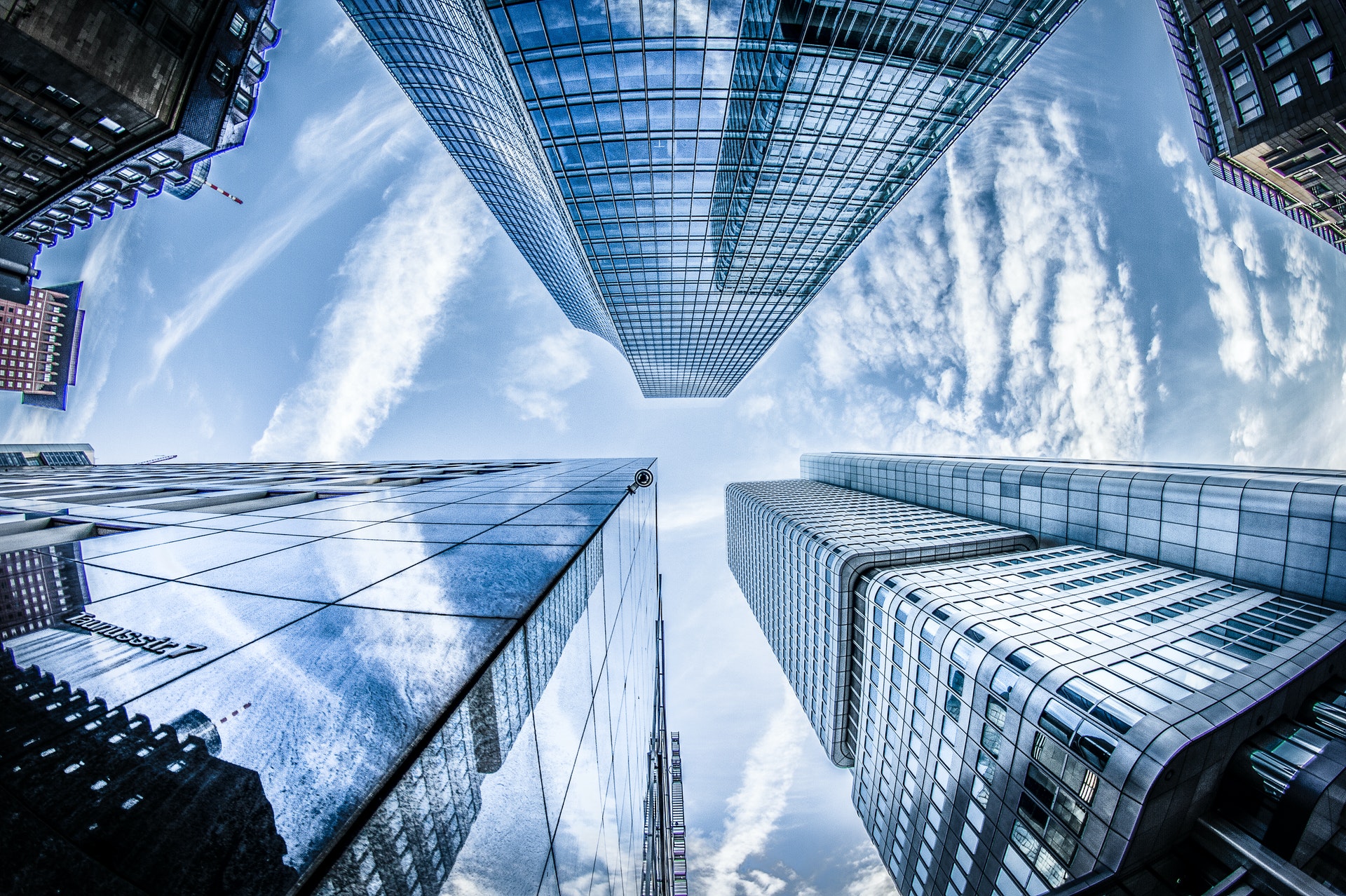 low-angle-photo-of-four-high-rise-curtain-wall-buildings-830891-1