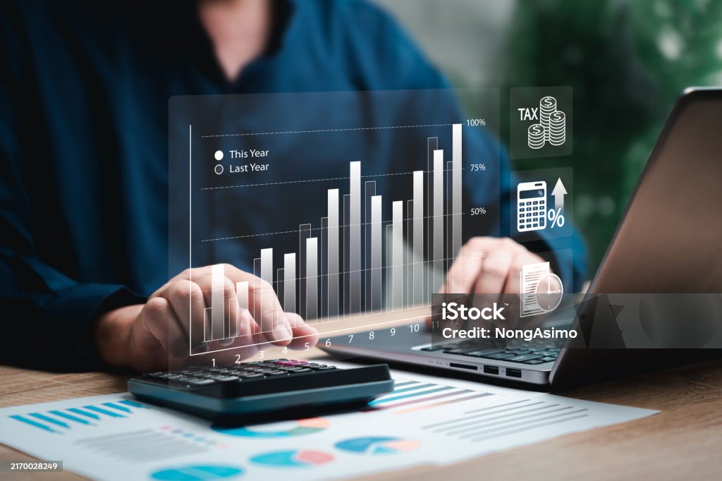 Small business owner analyzing cash flow and business operations on a laptop, with financial bar charts comparing this year and last year, calculator, and tax documents on the desk. Visual icons highlight taxes, small business tax strategy, capital gains, capital funding, payroll, HR, employee benefits, workforce retention, operational efficiency, exit strategy, and business savings account.